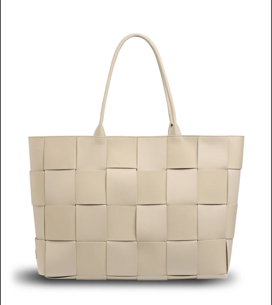 "Side angle of Buff Beige Prene Holiday Tote showing woven detail and structured silhouette"