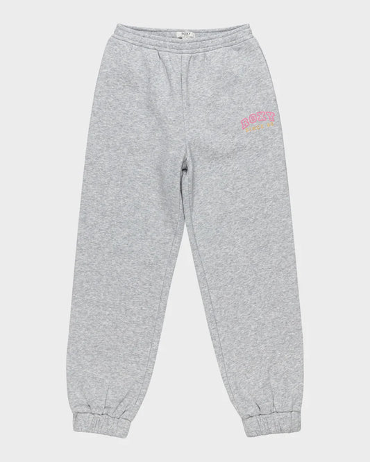 Flat lay of the Roxy Surf Feeling Wide Pant Brushed Trackpant for girls in heather grey, featuring an elastic waistband, cuffed ankles, and a pink and yellow Roxy logo on the left hip.