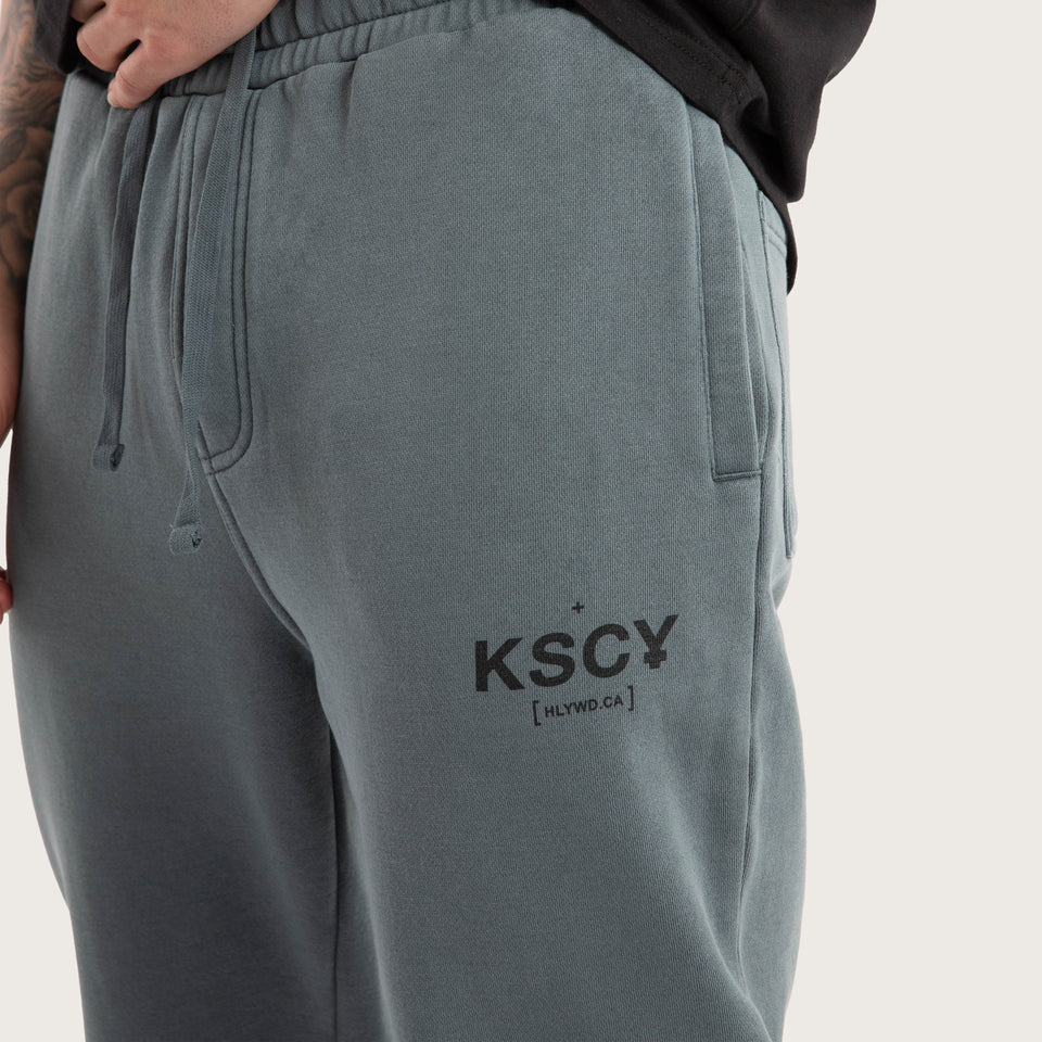 Side angle of Kiss Chacey Brea Trackpant showing pockets and logo
