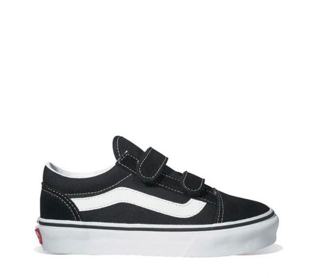Side view of black Vans Old Skool V Kids sneakers with white stripe and double velcro straps