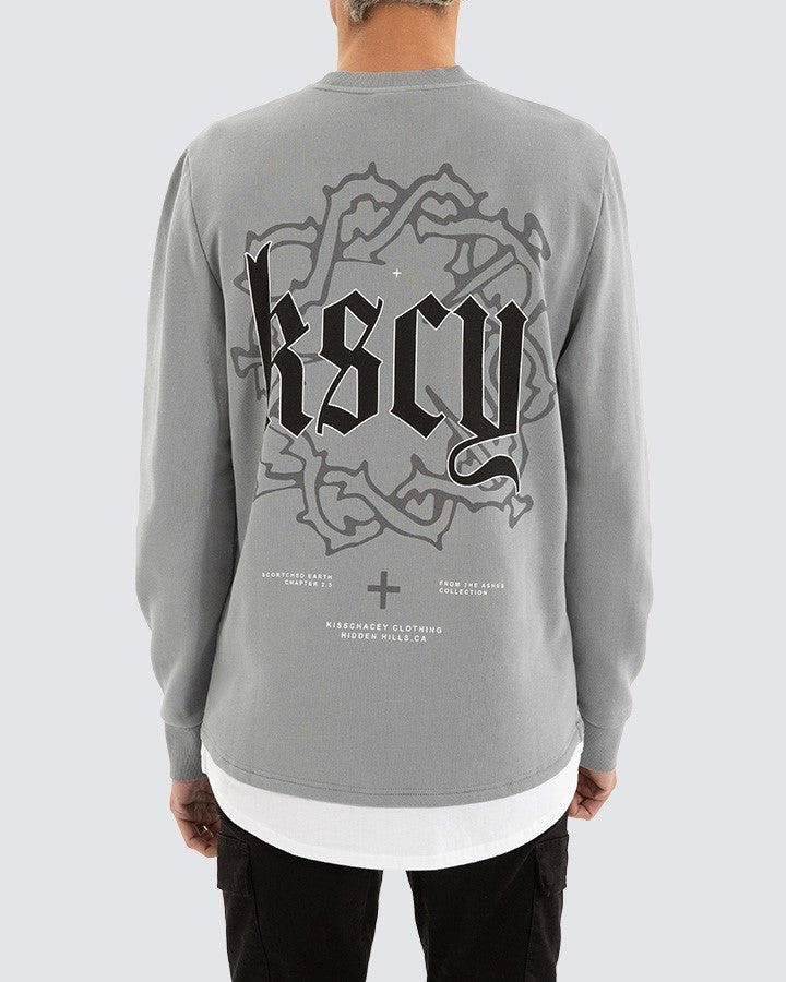 Back view of Kiss Chacey Weary Layered Sweater with gothic KSCY print