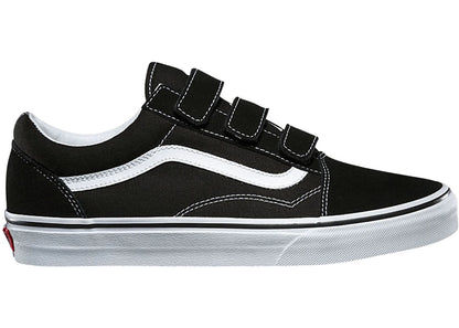 Side profile of the Vans Old Skool V Adult sneaker in black with Velcro straps and white side stripe.